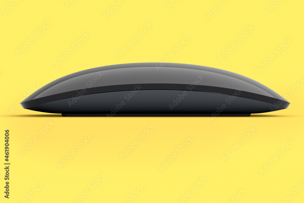 Realistic black wireless computer mouse with touch isolated on yellow background Realistic black wireless computer mouse with touch isolated on yellow background