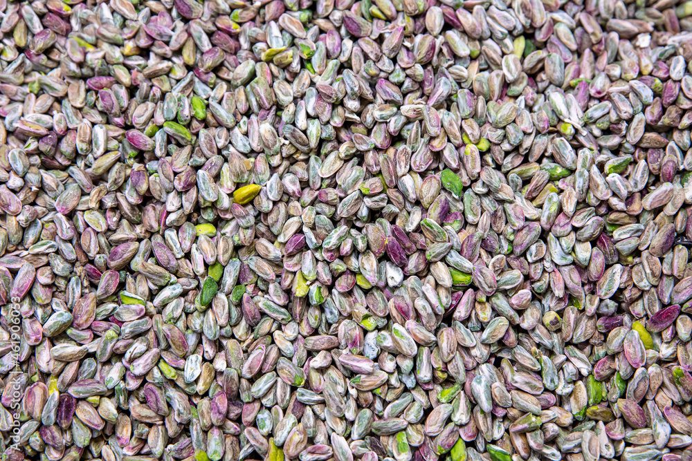 Preparation of pistachios in a baklava factory. A background of