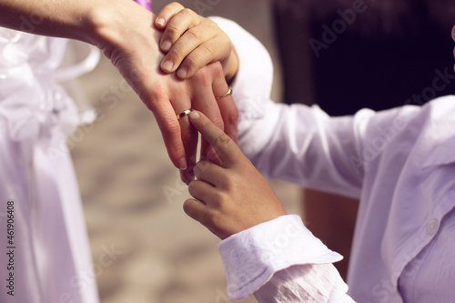 Beautiful hand of the bride at the wedding ceremony