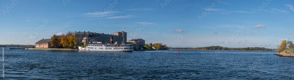Colorful autumn view over castle island Vaxholms fästning in the archipelago of Stockholm between the islands Rindö and Vaxön