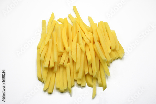 Potatoes cut into strips isolated on white background