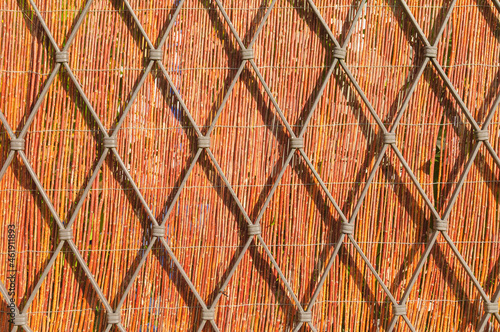 Wallpaper Mural This opaque fence is made out of reed and metal Torontodigital.ca