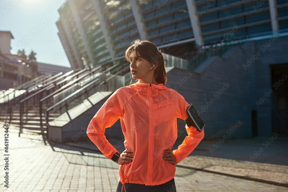 Sporty fit female workout using smartphone device - obrazy, fototapety, plakaty 