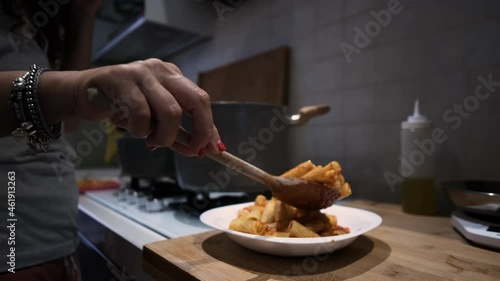 Serve delicious looking pasta on the plate. Tomato and meat ragu. Serve a professionally cooked pasta dish in the restaurant or for a romantic dinner at home. Slow motion close-up