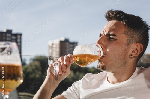 Man enjoying a glass of beer in urban outdoors