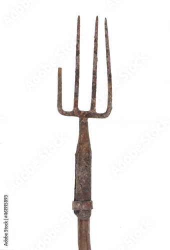 old rusty pitchfork isolated on white background