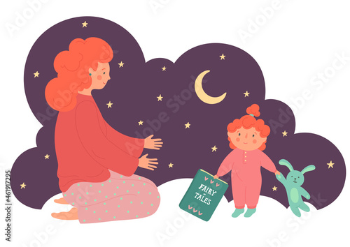 Fairy-tales. Reading book. Bedtime stories. Mother with child holding book at the night. 