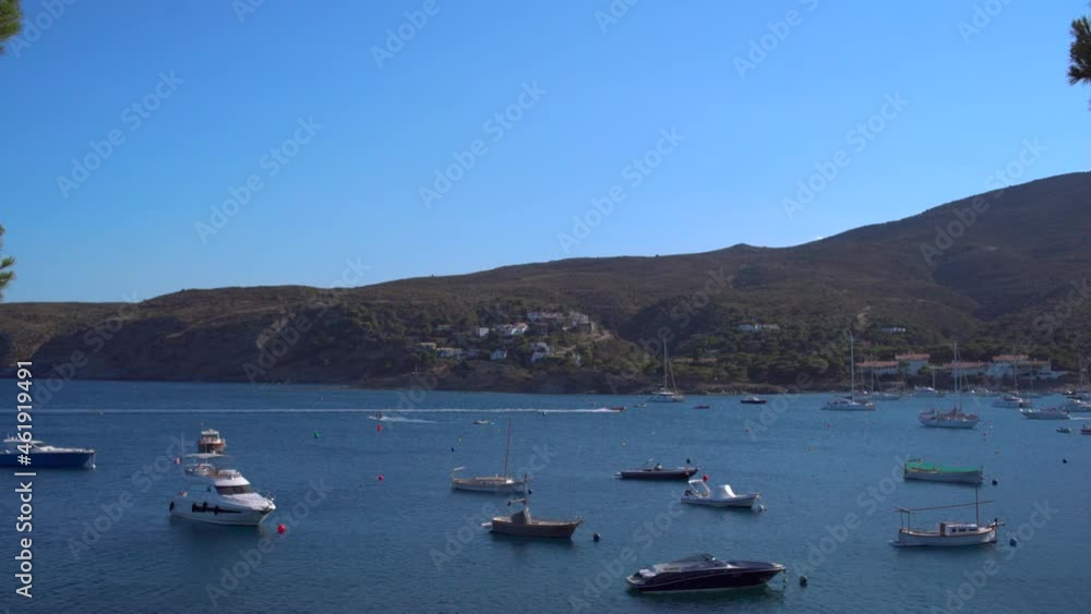 Boats anchored in the sea on a rocky bay Boats anchored in the sea on a rocky bay