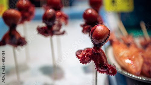 Small octopus on the sticks. A delicious traditional japanese street food snack