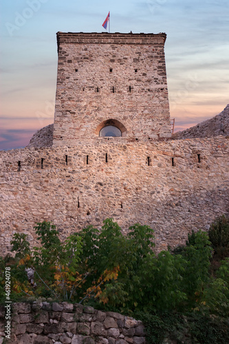 Low perspective ancient fortress in Pirot and first signs of autumn during sunset