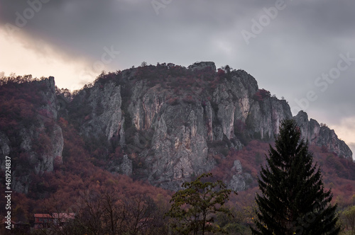 Artistic view of iconic mountain over village Vlasi in Serbia, near Pirot, during twilight photo