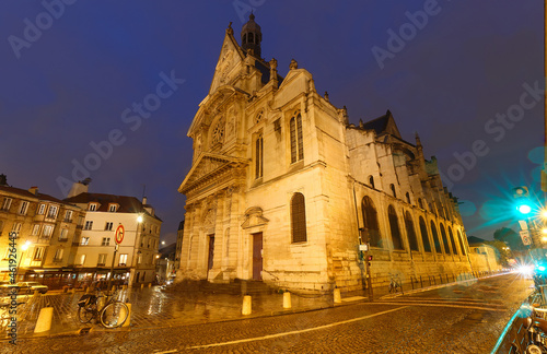 Church of Saint-Etienne-du-Mont at rainy night. It was built in 1494-1624 and located near the Pantheon - Paris, France