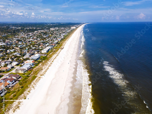 aerial view of the sandy beach with people having a rest. photo