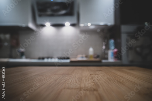 Wooden table top on blur kitchen room background. For displaying the assembly product or visual arrangement of the configuration keys
