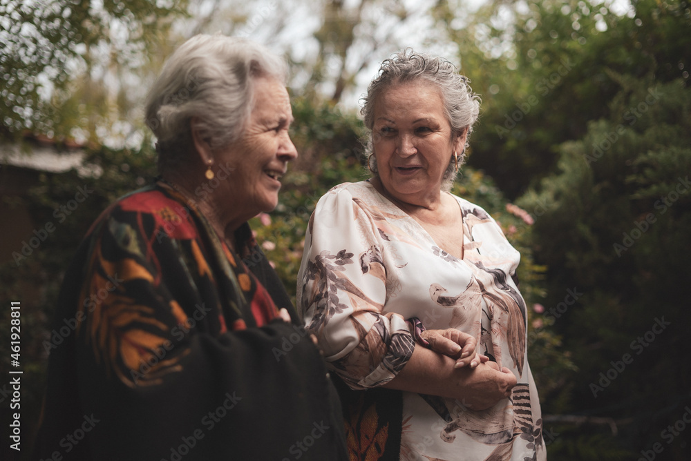 Cheerful senior women in garden Cheerful senior women in garden