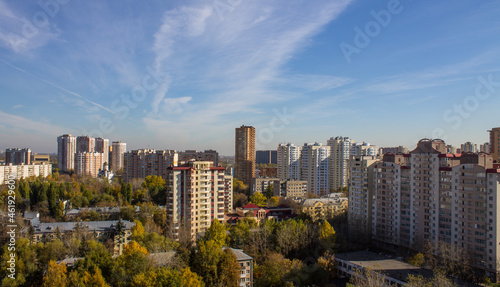 Cityscape - panoramic view of modern multi-storey buildings and colorful autumn trees on a sunny  clear day in Reutov  Russia.