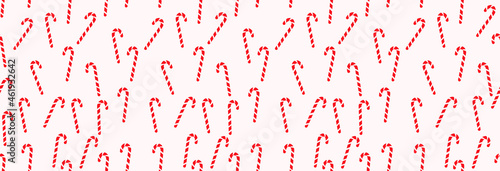 Seamless pattern, Christmas peppermint candy cane on a light background.
