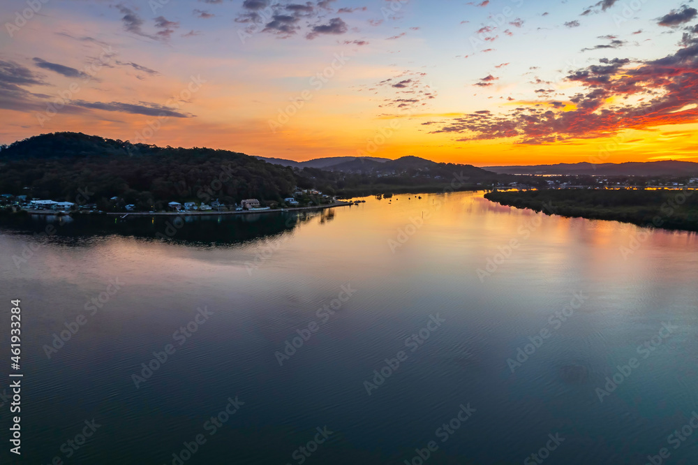 Fototapeta premium Sunrise waterscape and clouds with reflections