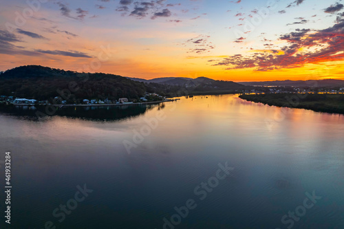 Sunrise waterscape and clouds with reflections