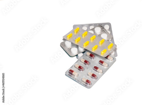Pills on a white background. Various medicines in blisters.