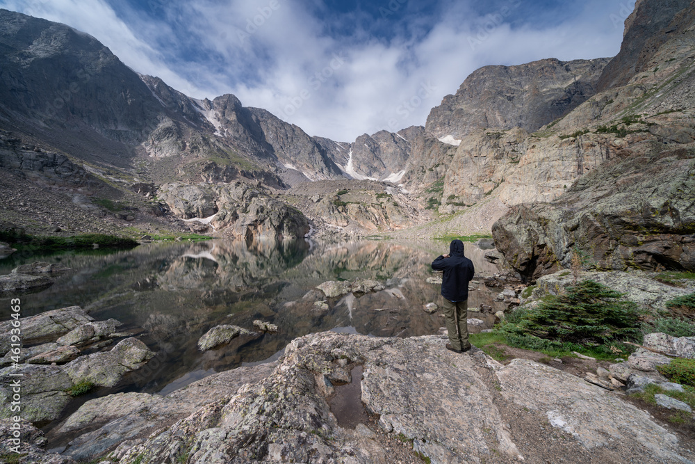 Sky Pond in Rocky Mountain National Park Colorado, with an unidentifiable man taking photos