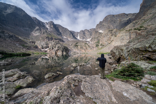 Sky Pond in Rocky Mountain National Park Colorado, with an unidentifiable man taking photos