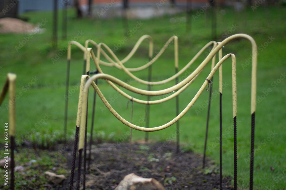 Racks for keeping plants in the garden. Supports for plants.