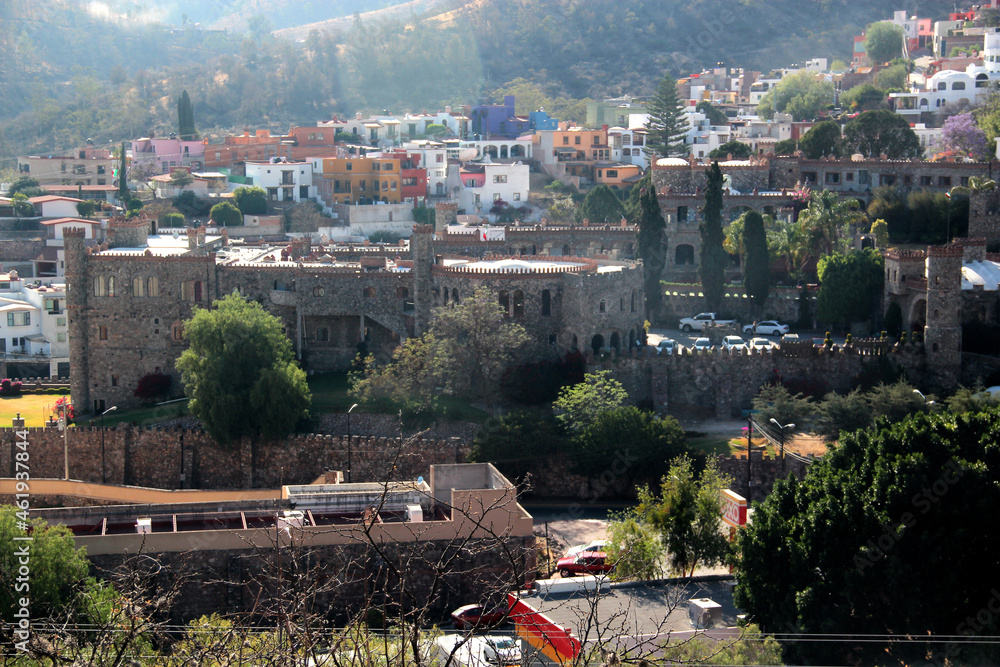View of the city of Guanajuato Mexico with its medieval colonial style stone buildings between mountains
