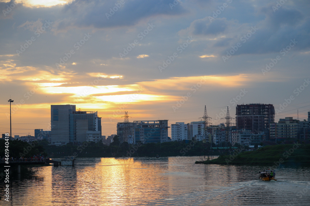 Lake view of Dhaka city with skyline buildings in the evening