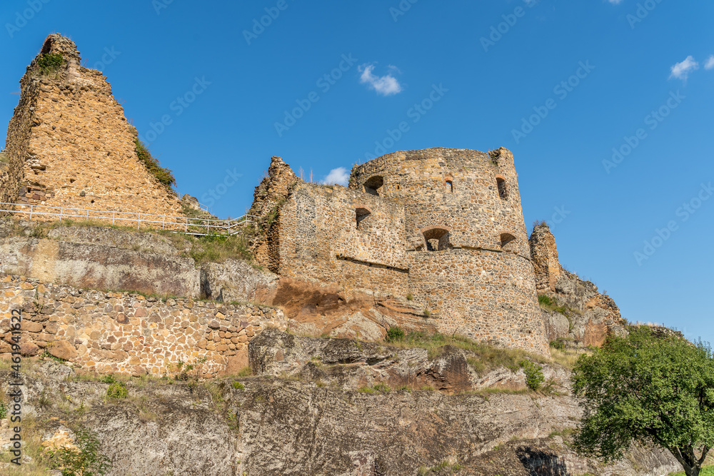 Aerial view of partially restored medieval Filakovo Fulek castle in Southern Slovakia with cannon bastion summer view with blue cloudy sky historic monument from the Turkish Hungarian wars