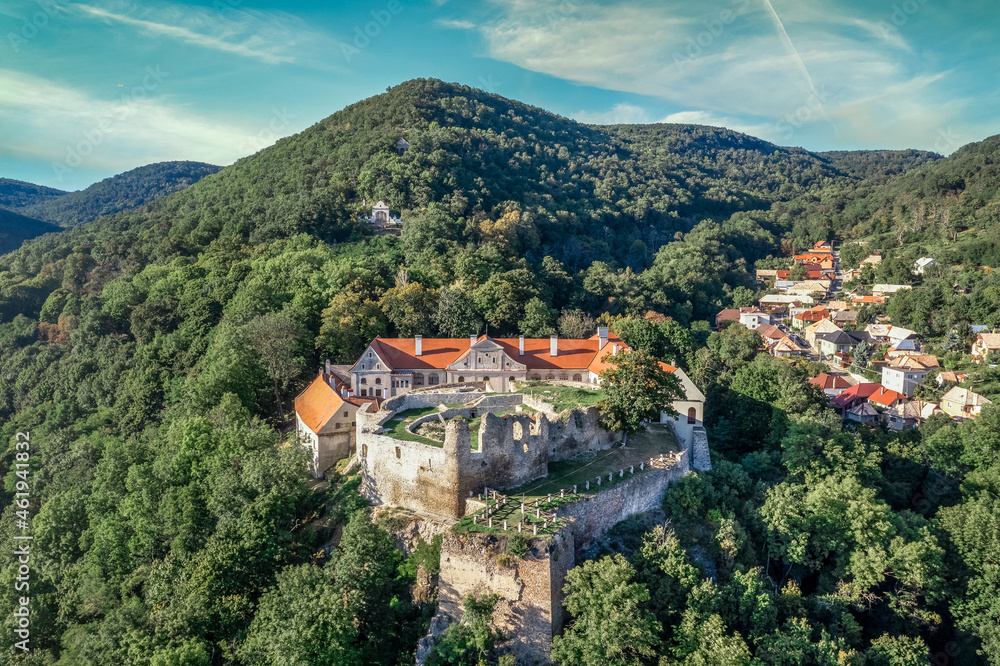 Aerial panoramic view of Gothic hilltop ruined castle Kekko, Modry Kamen or Blue Stone, in Southern Slovakia above a village Aerial panoramic view of Gothic hilltop ruined castle Kekko, Modry Kamen or Blue Stone, in Southern Slovakia above a village
