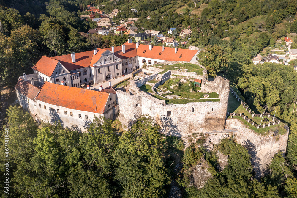 Aerial panoramic view of Gothic hilltop ruined castle Kekko, Modry Kamen or Blue Stone, in Southern Slovakia above a village