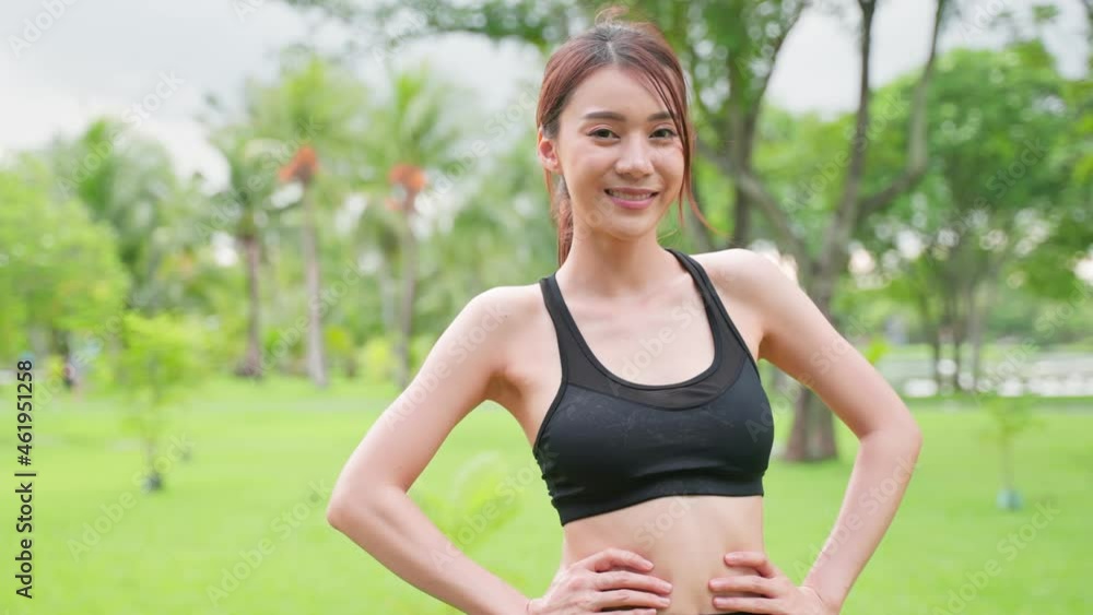 Asian active sport woman stand with confidence after exercise outdoors. Asian active sport woman stand with confidence after exercise outdoors.