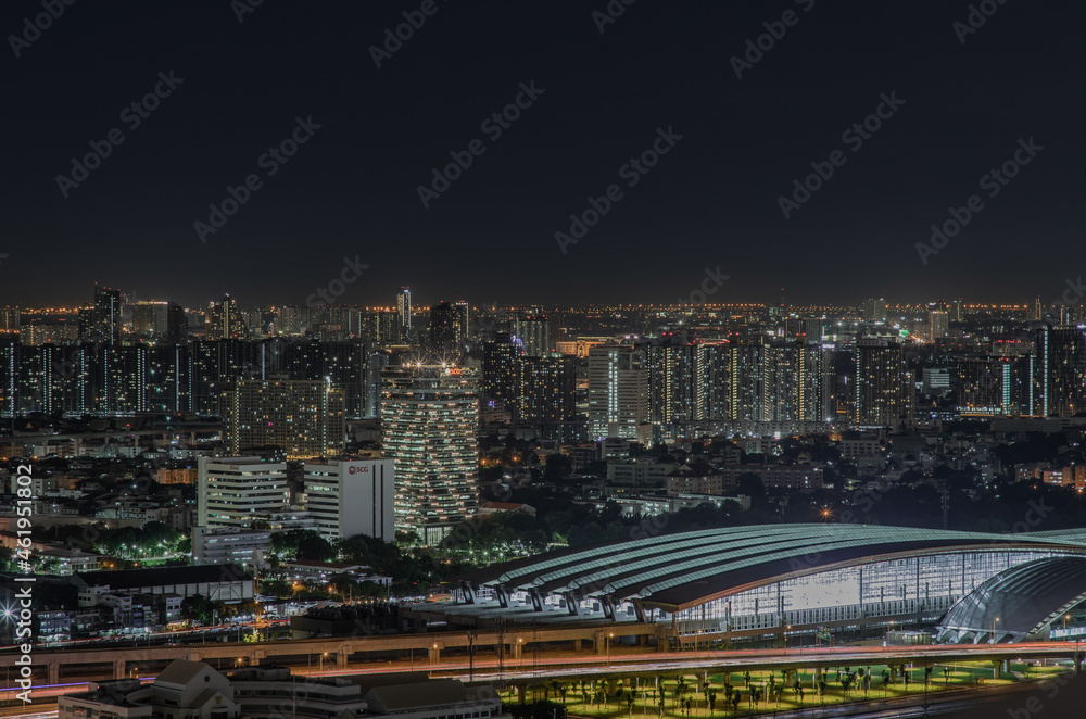 Bangkok, thailand - Aug 28, 2020 : Aerial view of Bang Sue central station with skyscrapers background at night. Selective focus.