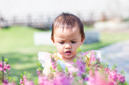happy girl watching the flower garden