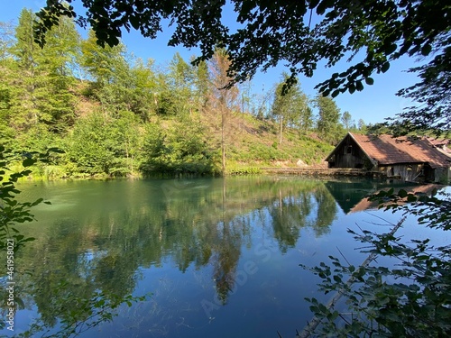 Remains of an old sawmill on the small dam of Čogrljevo Lake in the mountain hamlet of Tići - Gorski kotar, Croatia (Ostaci stare pilane na maloj brani Čogrljevog jezera u goranskom zaselku Tići)