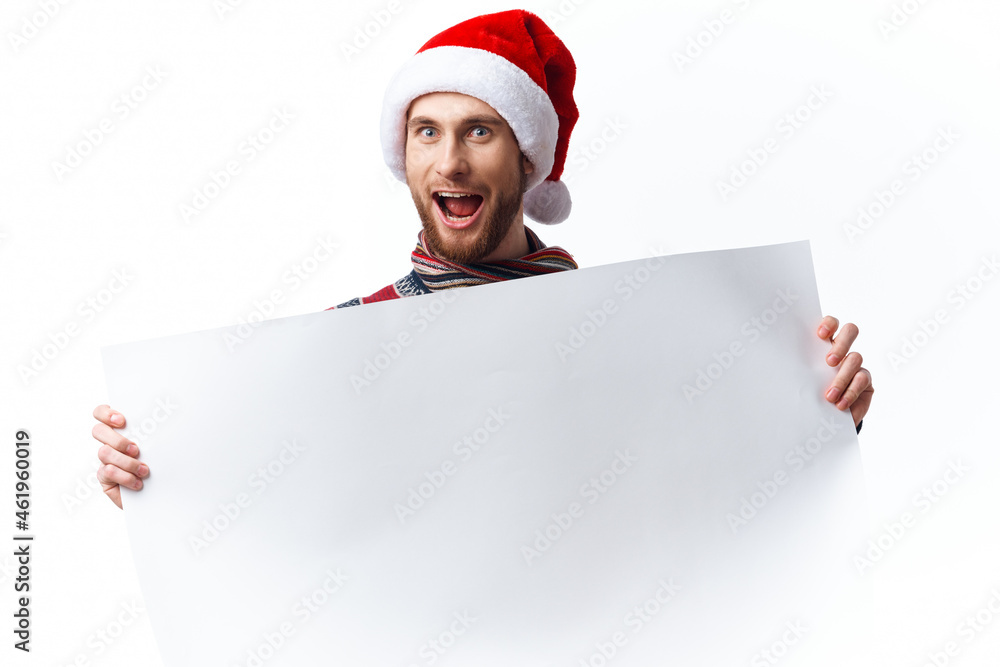handsome man in New Year's clothes holding a banner holiday copy-space studio handsome man in New Year's clothes holding a banner holiday copy-space studio