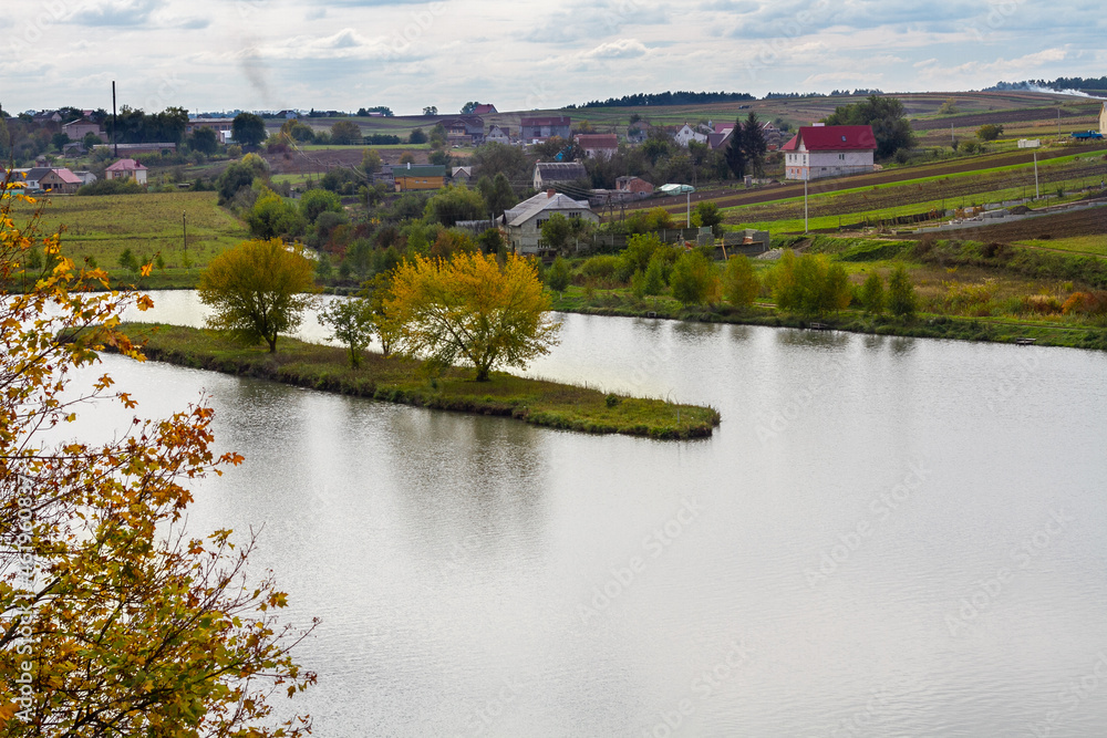 Lake near the village in Ukraine, autumn day