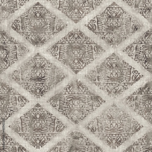 Seamless tan brown grungy tribal neutral rug motif surface pattern design for print. High quality illustration. Distressed bohemian ethnic repeat swatch. Hand drawn diamond damask textile design.