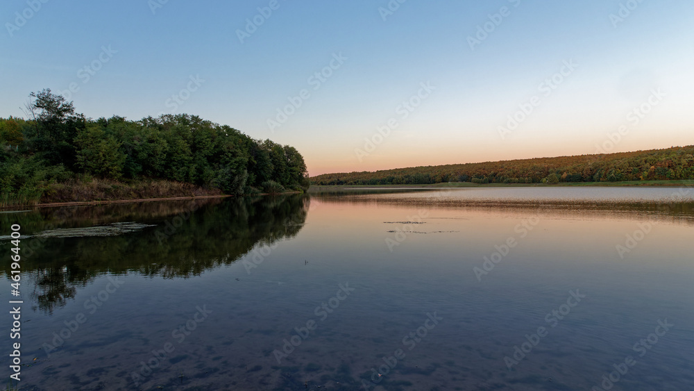 Jezero Lapovac at dusk with autumn colors near Nasice, Croatia