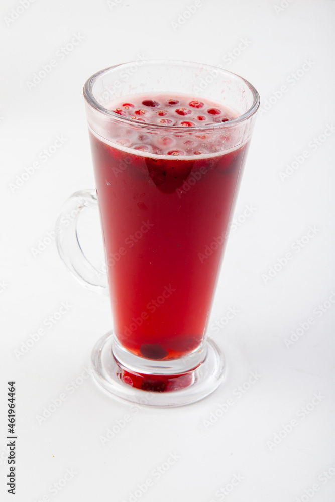 hot berry drinks in a glass glass on a white background hot berry drinks in a glass glass on a white background