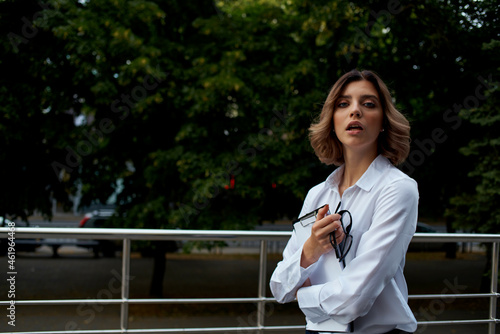 cheerful business woman with documents in her hands on the street walk © SHOTPRIME STUDIO