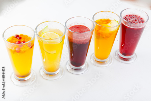 hot berry drinks in a glass glass on a white background