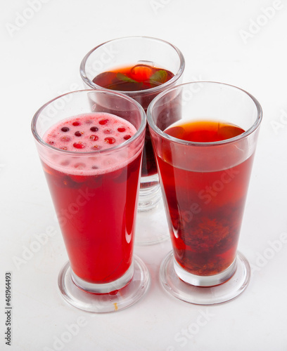 hot berry drinks in a glass glass on a white background