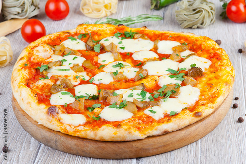 italian pizza on a wooden background with decoration around