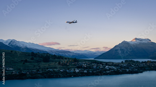 Air NZ Plane flying above Lake Wakatipu during sunset. July 2021, Queenstown, New Zealand