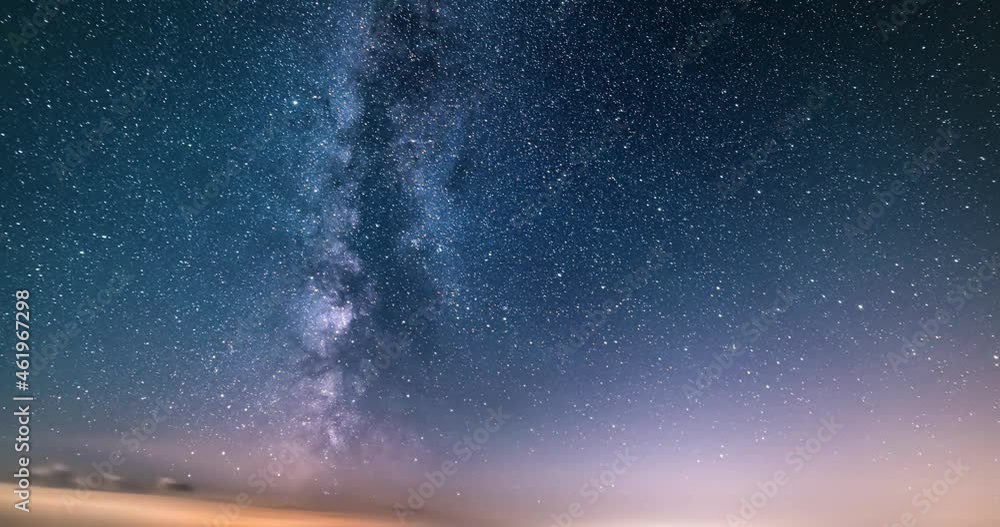 Milky way galaxy stars in starry sky background with fast clouds motion, Astronomy Time lapse Night to day