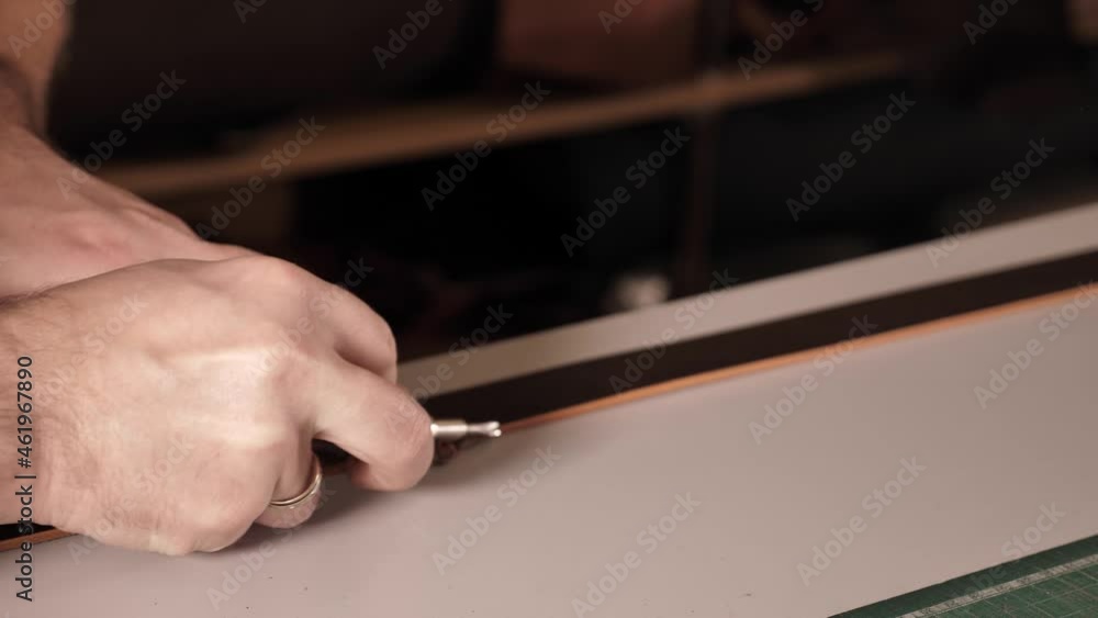 Man working with production leather goods. there is no human face, the master man takes the detail.
