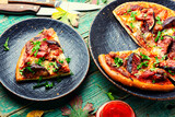 Pizza with meat and fruits