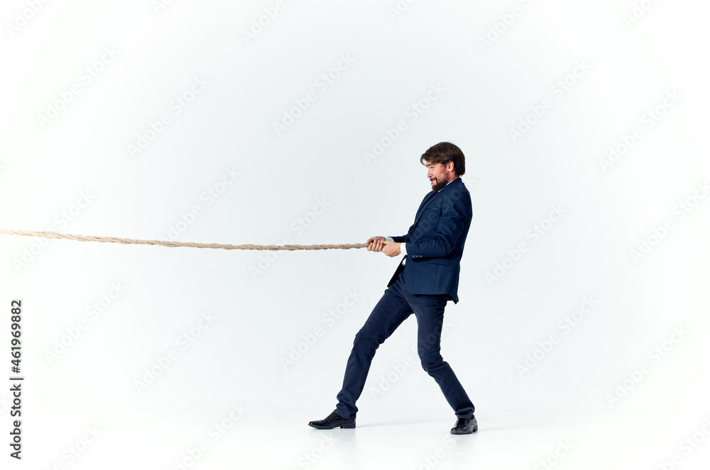 a man in a suit pulls the rope emotion work office a man in a suit pulls the rope emotion work office